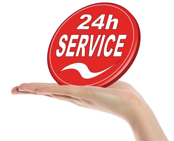 A neat human hand holding a stylized sign that offers a 24 hour service. All isolated on white background.
